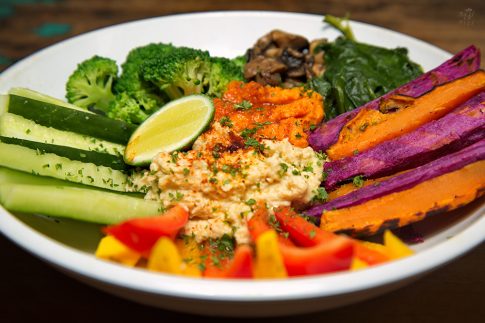 Vegan food - brocoli, humus, mushrooms and red pepper