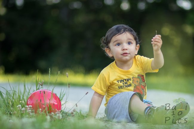 Kid with flower in forest