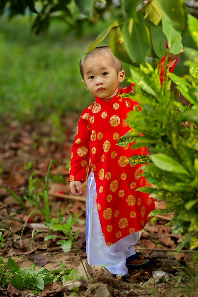 Kid with traditional clothes Ao Dai - Vietnam