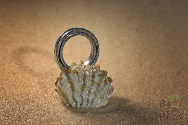 Wedding rings on the sand
